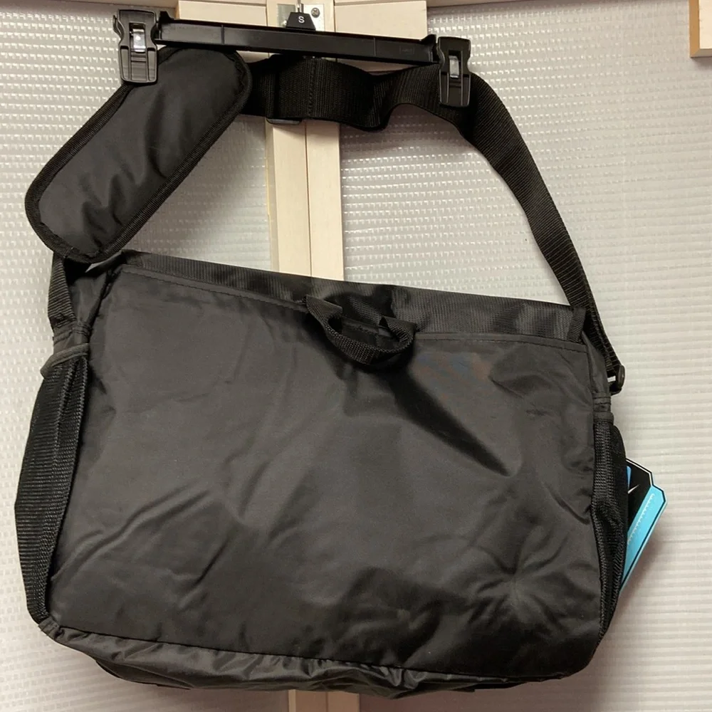 Messenger bag features laptop sleeve- multi- function pockets— Adjustable strap